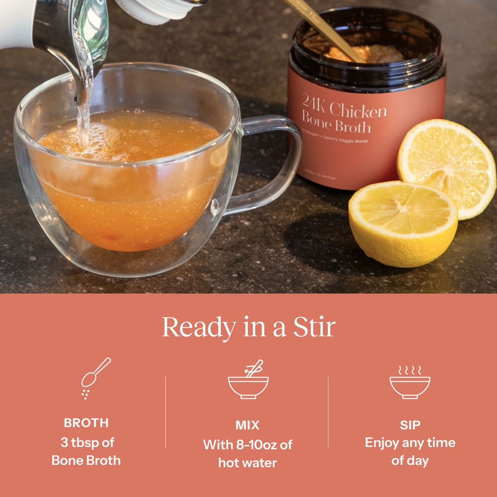 Glass mug with bone broth being poured, jar of bone broth, and lemons on a dark surface.