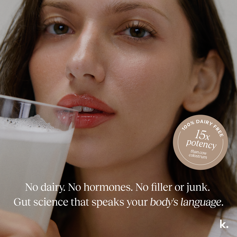 Woman drinking a dairy-free product with a label on a white background
